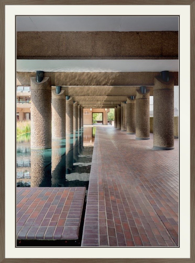 Framed architectural photograph of the Barbican Centre colonnade and reflecting pool in a warm oak frame